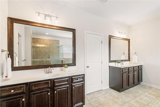 bathroom with vanity and a shower with shower door