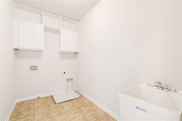 washroom with cabinets, washer hookup, sink, and hookup for an electric dryer