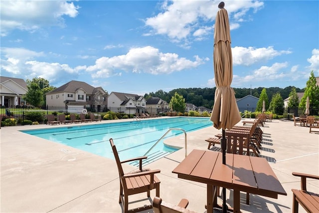 view of swimming pool with a patio