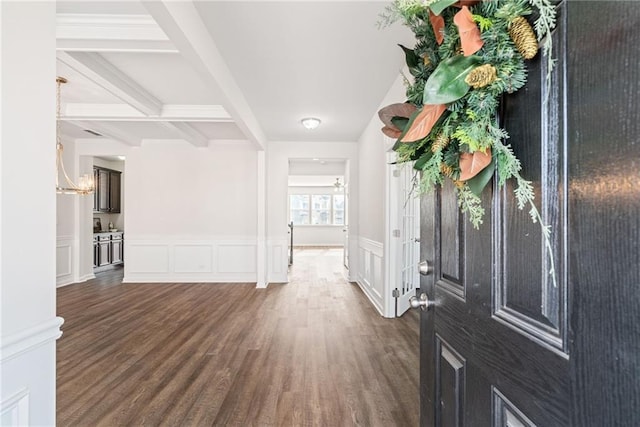 entryway featuring beamed ceiling and dark wood-type flooring