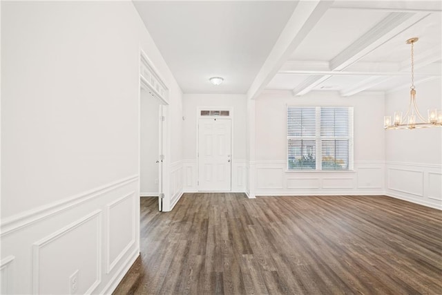 entryway with dark hardwood / wood-style flooring, beam ceiling, and a chandelier