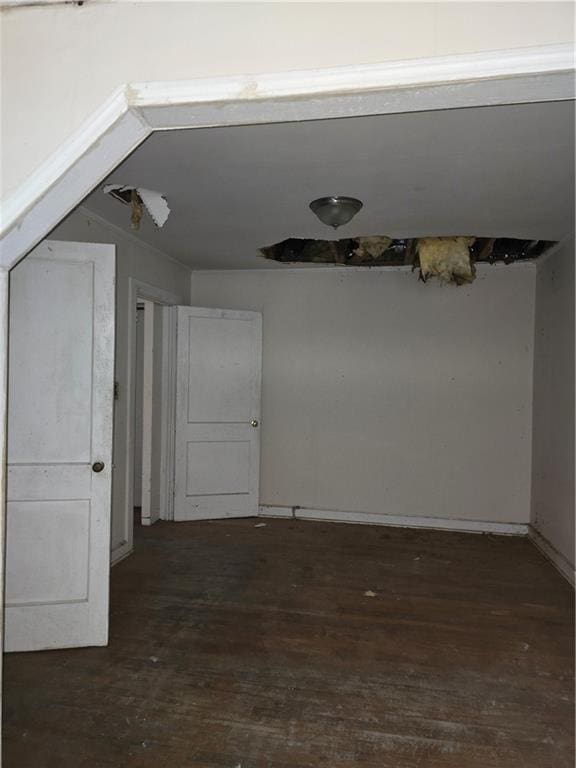unfurnished room with wood-type flooring