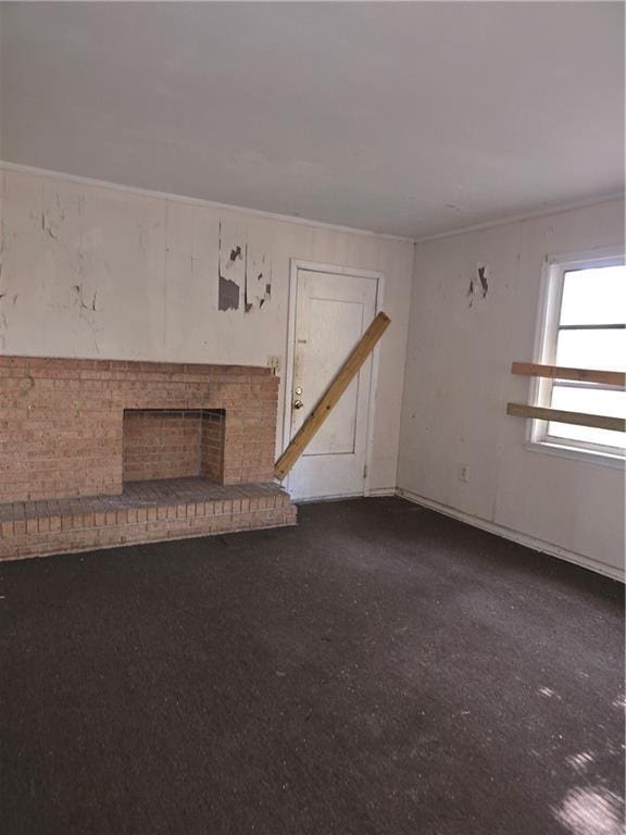 unfurnished living room featuring a fireplace