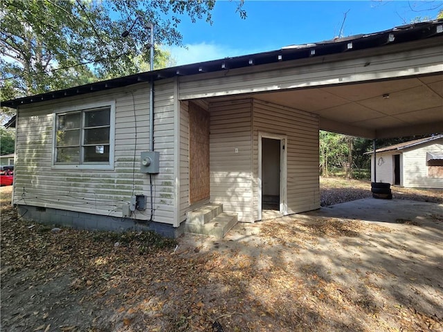exterior space featuring entry steps and a carport