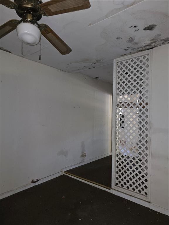 unfurnished room featuring a ceiling fan