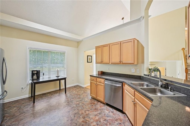 3705 Tate Pl, Austell, GA 30106 - kitchen with stainless steel appliances, a sink, stone finish flooring, dark countertops, and baseboards