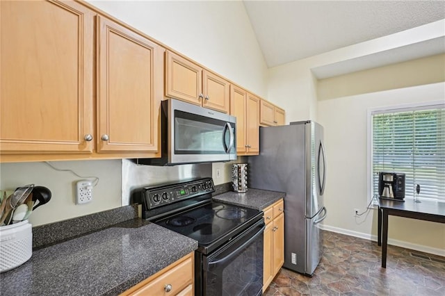 3705 Tate Pl, Austell, GA 30106 - kitchen featuring stainless steel appliances, dark countertops, lofted ceiling, light brown cabinets, and baseboards