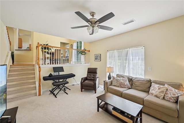 3705 Tate Pl, Austell, GA 30106 - living area with stairs, ceiling fan, carpet floors, and baseboards