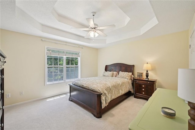 3705 Tate Pl, Austell, GA 30106 - bedroom with a raised ceiling, light carpet, ceiling fan, and baseboards