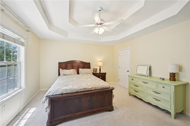 3705 Tate Pl, Austell, GA 30106 - bedroom with a tray ceiling, light carpet, a ceiling fan, and baseboards
