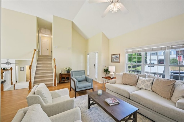 3705 Tate Pl, Austell, GA 30106 - living room with a ceiling fan, high vaulted ceiling, stairs, and wood finished floors