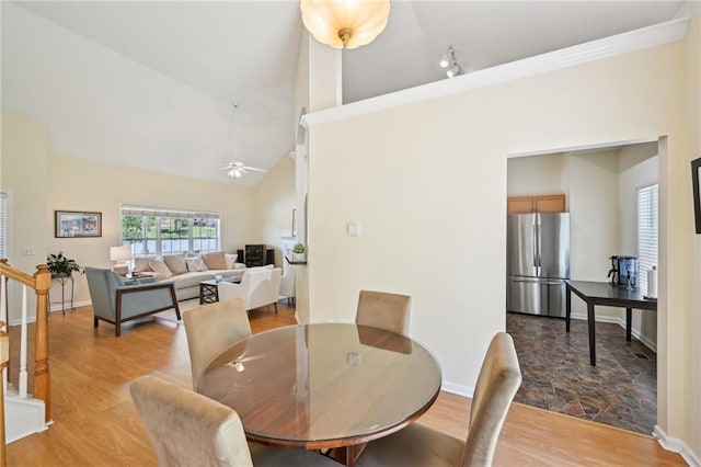 3705 Tate Pl, Austell, GA 30106 - dining space with baseboards, high vaulted ceiling, ceiling fan, and light wood-type flooring