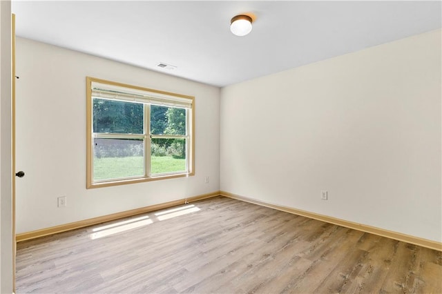 1492 Station Ridge Ct, Lawrenceville, GA 30045 - spare room featuring wood finished floors and baseboards