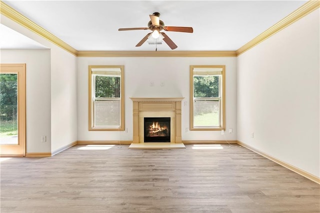 1492 Station Ridge Ct, Lawrenceville, GA 30045 - unfurnished living room featuring plenty of natural light, a ceiling fan, crown molding, a fireplace with flush hearth, and wood finished floors