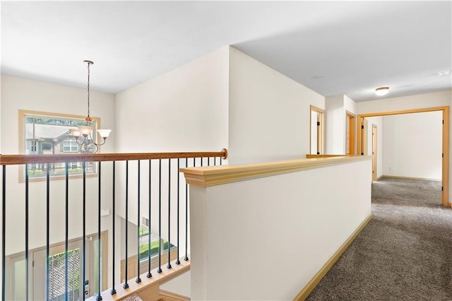 1492 Station Ridge Ct, Lawrenceville, GA 30045 - hallway featuring a chandelier and carpet floors