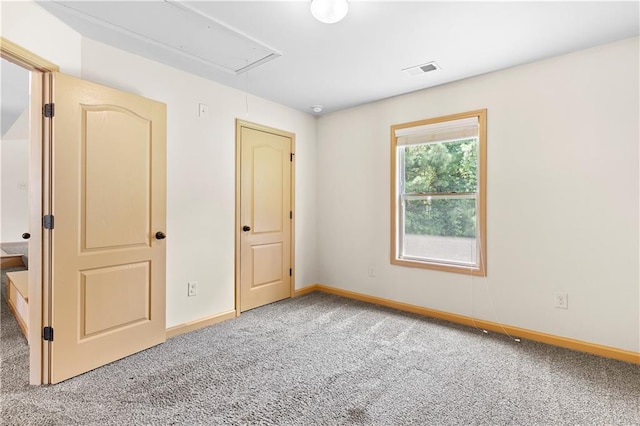 1492 Station Ridge Ct, Lawrenceville, GA 30045 - unfurnished bedroom with attic access and carpet