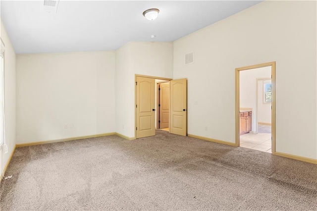 1492 Station Ridge Ct, Lawrenceville, GA 30045 - unfurnished bedroom featuring carpet flooring, high vaulted ceiling, and ensuite bathroom