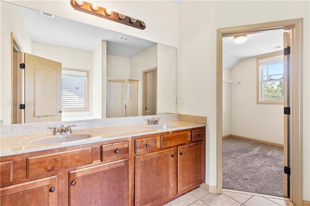 1492 Station Ridge Ct, Lawrenceville, GA 30045 - bathroom with double vanity, a shower with shower door, and tile patterned flooring