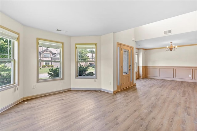 1492 Station Ridge Ct, Lawrenceville, GA 30045 - unfurnished room with a chandelier and light wood-style flooring