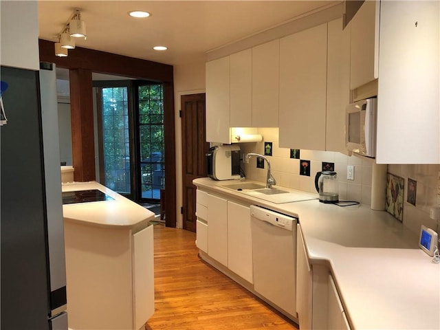 5015 Wright Bridge Rd, Cumming, GA 30028 - kitchen featuring white appliances, light countertops, backsplash, white cabinetry, and recessed lighting
