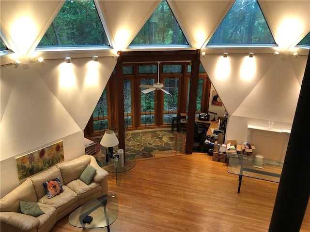 5015 Wright Bridge Rd, Cumming, GA 30028 - living area featuring wood finished floors, a high ceiling, and ceiling fan