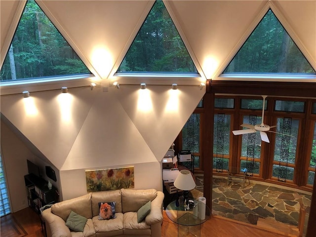 5015 Wright Bridge Rd, Cumming, GA 30028 - home theater room with wood finished floors, ceiling fan, and lofted ceiling
