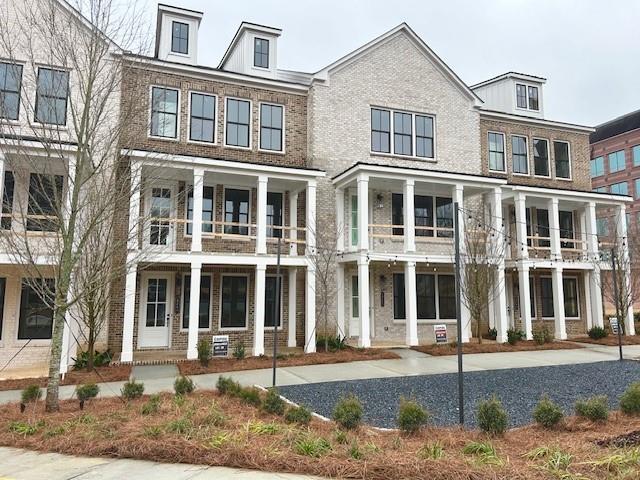 view of front of property featuring brick siding