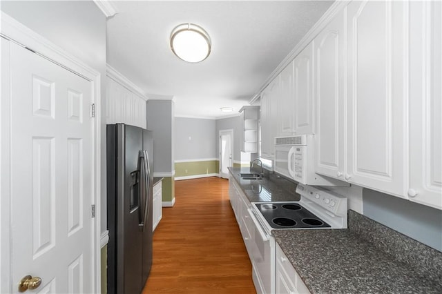 kitchen featuring dark hardwood / wood-style floors, sink, white cabinets, ornamental molding, and white appliances