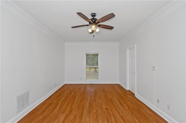 unfurnished room with crown molding, light hardwood / wood-style floors, and ceiling fan