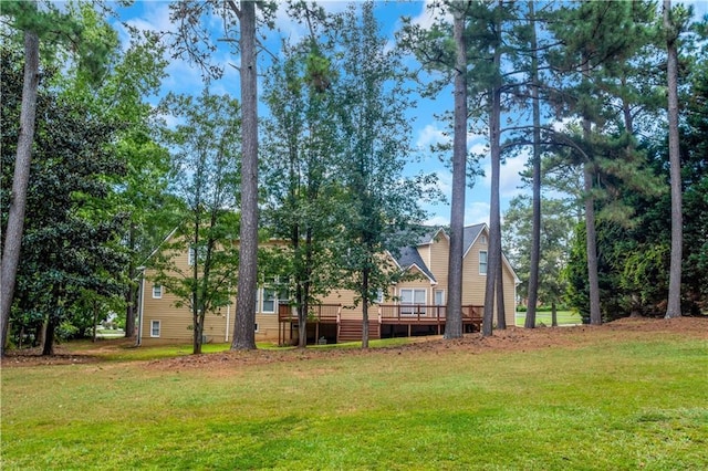 view of yard featuring a wooden deck