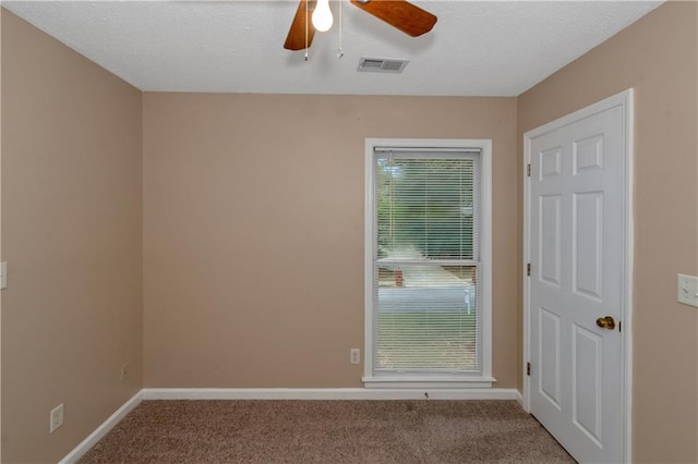 carpeted empty room with ceiling fan