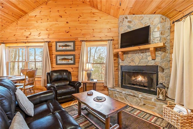 living room with a stone fireplace, wooden ceiling, lofted ceiling, and wooden walls