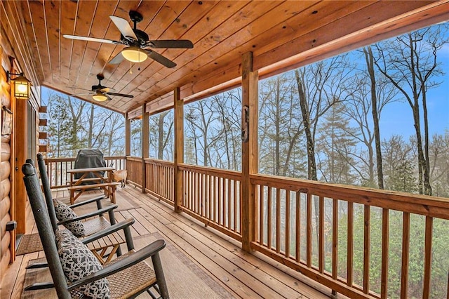 wooden terrace featuring ceiling fan