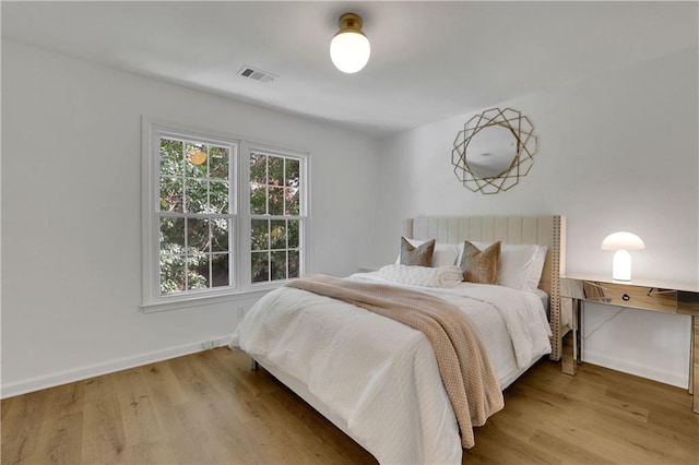 bedroom featuring hardwood / wood-style floors