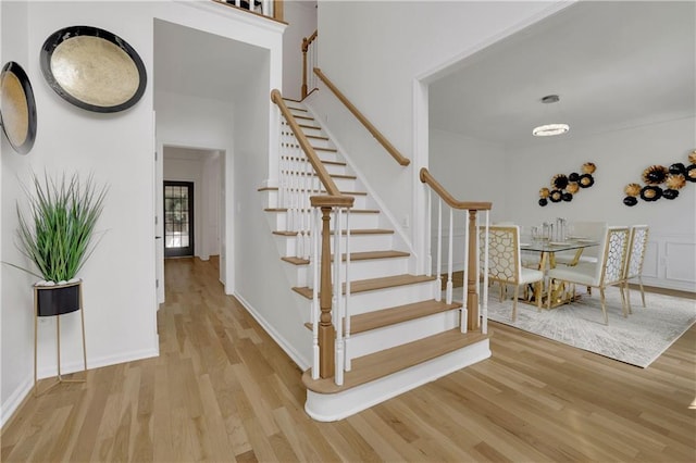 staircase featuring wood-type flooring