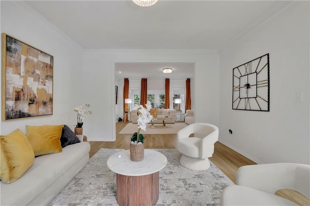 living room featuring wood-type flooring and crown molding