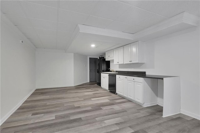 kitchen featuring light wood-type flooring, black appliances, and white cabinets