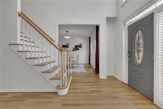 foyer entrance with light wood-type flooring