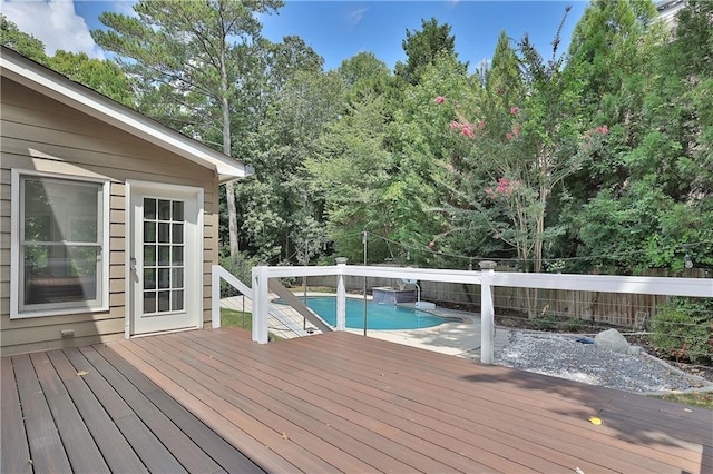 wooden deck featuring a fenced in pool