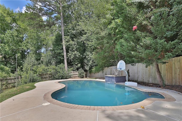 view of pool with pool water feature and a patio