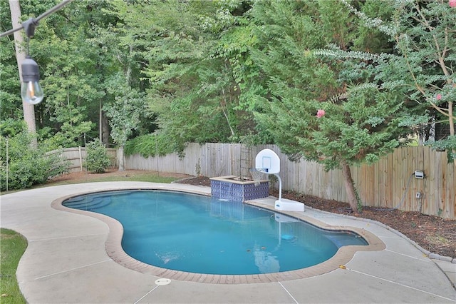 view of swimming pool featuring a patio area and pool water feature