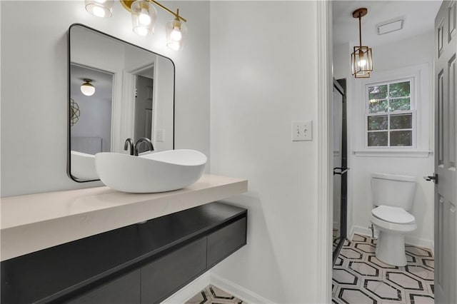 bathroom featuring vanity and toilet