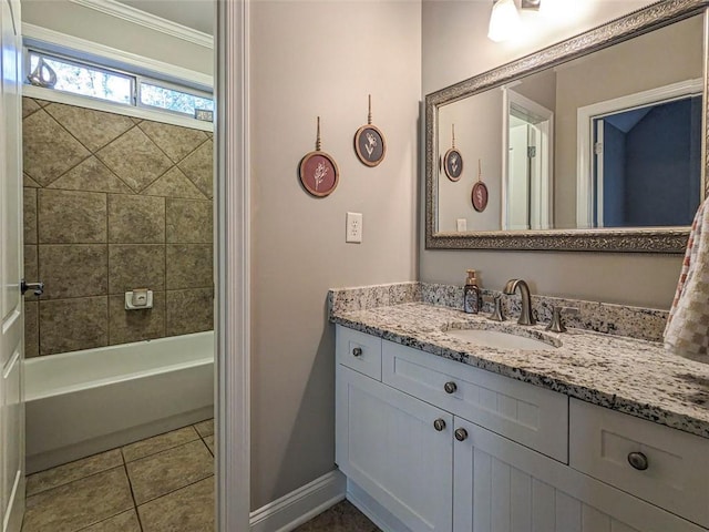 bathroom featuring tiled shower / bath combo, vanity, tile patterned floors, and crown molding