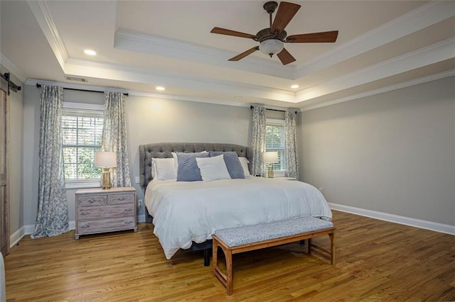 bedroom featuring crown molding, hardwood / wood-style floors, and ceiling fan