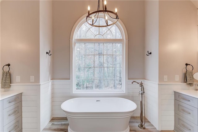 bathroom featuring toilet, vanity, and ornamental molding