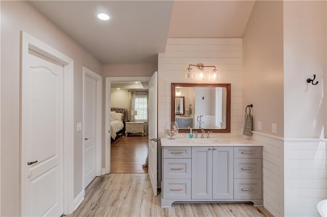 bathroom with vanity and hardwood / wood-style flooring