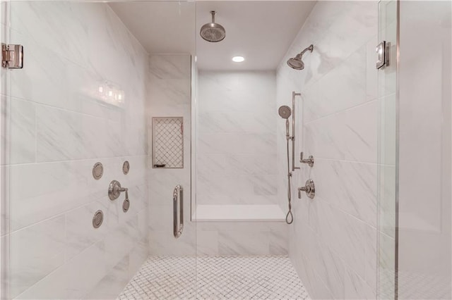 bathroom with a shower with shower door