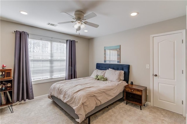 carpeted bedroom with ceiling fan