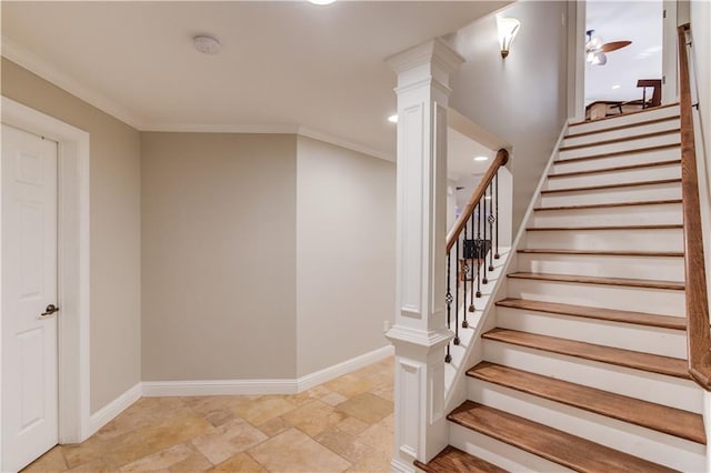 staircase featuring decorative columns, ceiling fan, and crown molding