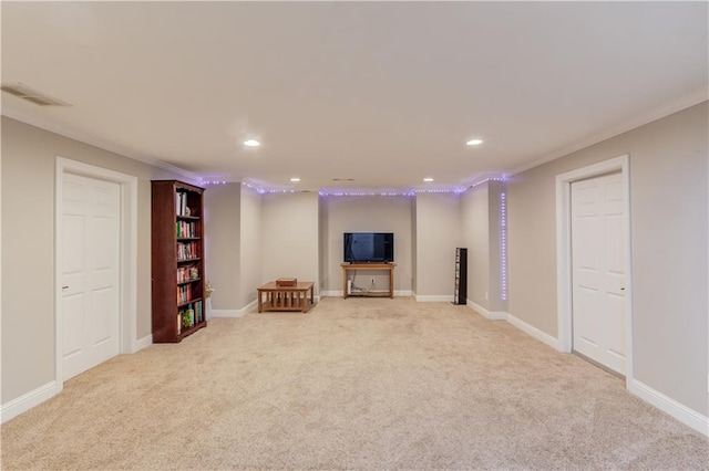 basement with crown molding and light colored carpet